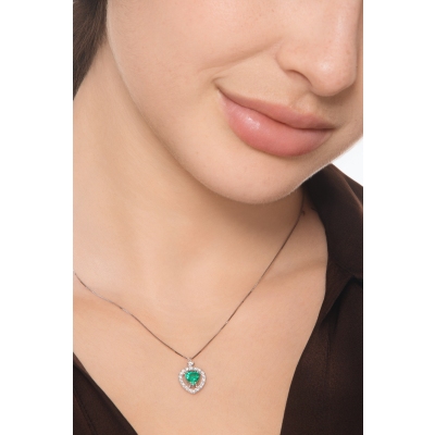 Halo necklace with emerald and diamonds