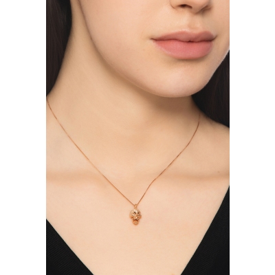 18k rose gold skull with black and white diamonds