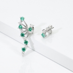 Asymmetric 18k white gold earrings with emeralds and diamonds