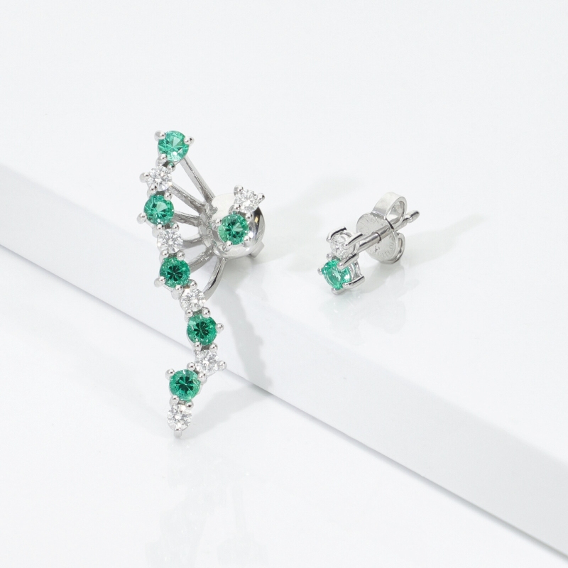 Asymmetric 18k white gold earrings with emeralds and diamonds