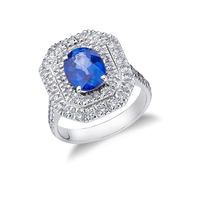 Halo ring with a central blue sapphire and diamonds white gold 18k