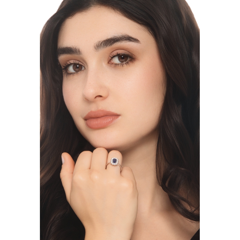 White gold 18k halo ring with diamonds and central blue sapphire 