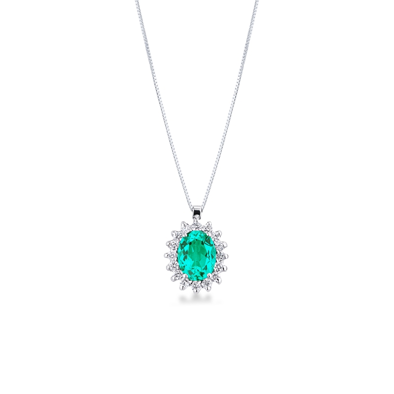 CIONDOLO CONTORNO 16BRILLANTI CON SMERALDO OVALE MM8X6.