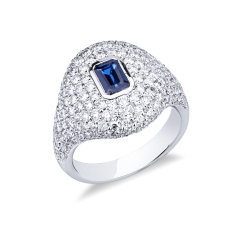 Anello in oro bianco 18k con pavé in diamanti e zaffiro blu centrale