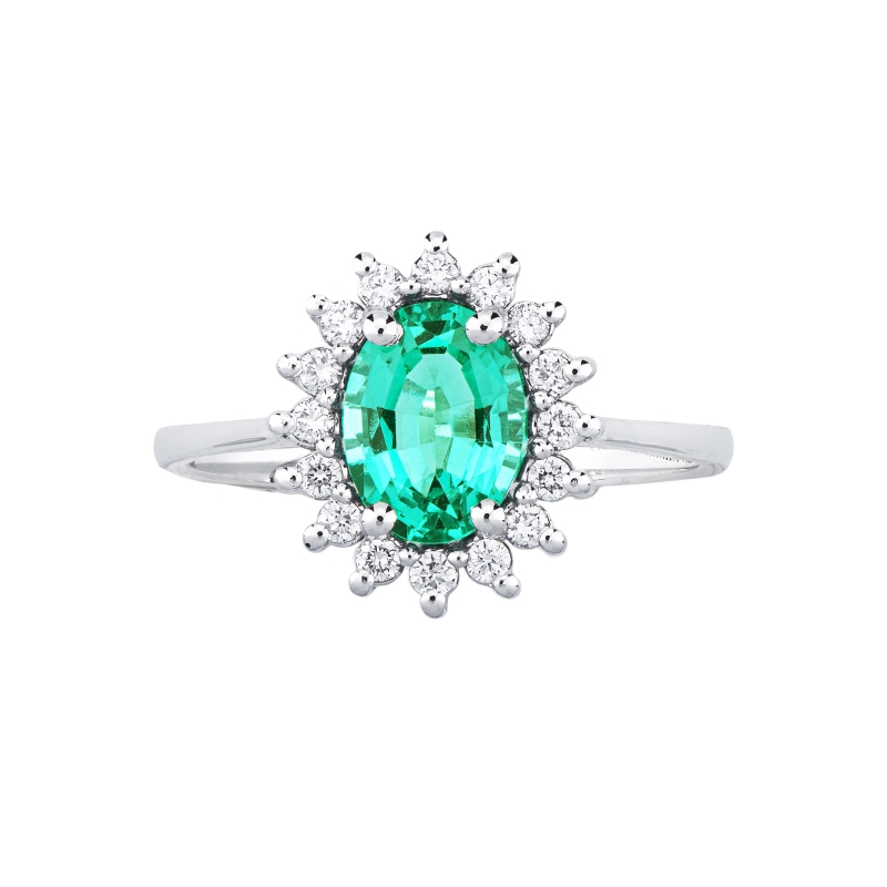 18k white gold ring with emerald oval cut and diamonds