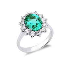 ANELLO CONTORNO CON SMERALDO OVALE MM10X8 E 12BRILLANTI