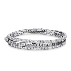 Bracciale stretch a molla in oro bianco 18k con diamanti taglio brillante e princess