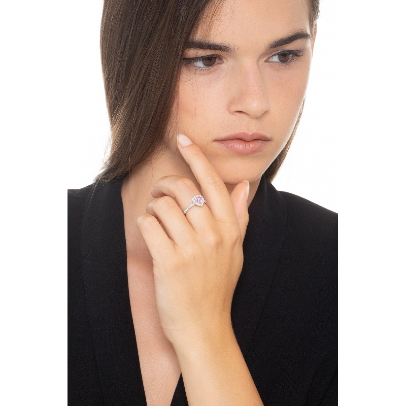 White gold 18k halo ring with a heart shaped pink sapphire of about 6mm and diamonds