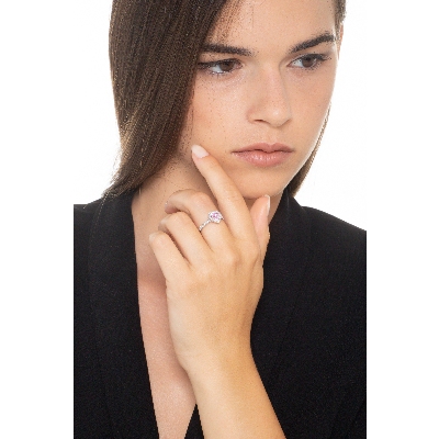 White gold 18k halo ring with a heart shaped pink sapphire of about 6mm and diamonds