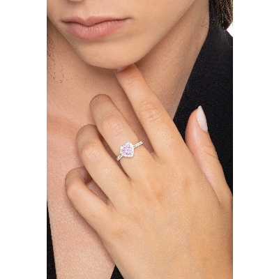 White gold 18k halo ring with a heart shaped pink sapphire of about 6mm and diamonds