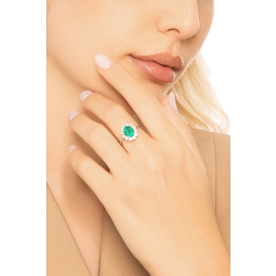 ANELLO CONTORNO CON 12BRILLANTI E SMERALDO OVALE MM9X7