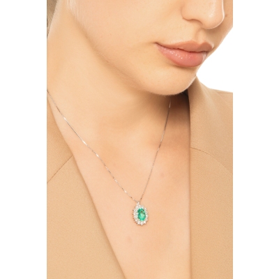 CIONDOLO CONTORNO 14BRILLANTI CON SMERALDO OVALE MM9X7
