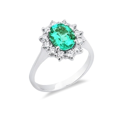 ANELLO CONTORNO CON 12BRILLANTI E SMERALDO OVALE MM9X7