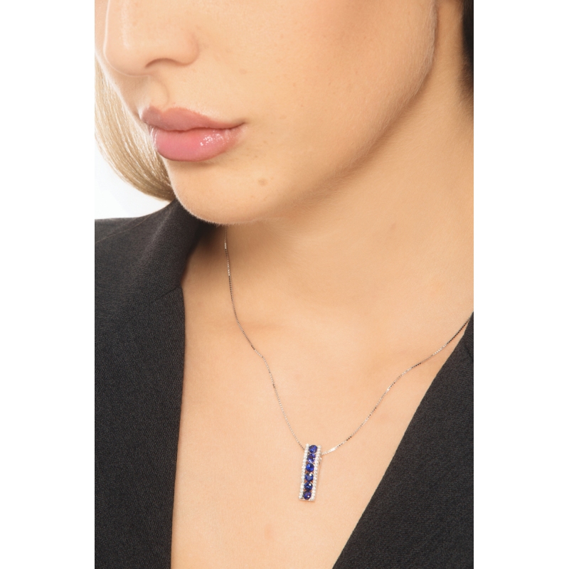 18k white gold bar pendant with diamonds and blue sapphires