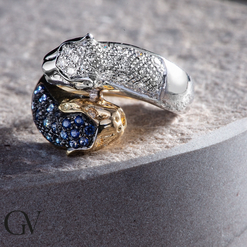 White and yellow gold 18k ring with panther of diamonds and blue sapphires 