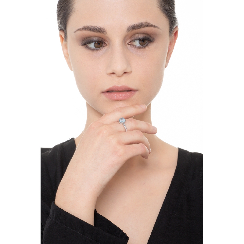 White gold 18k ring with an aquamarine heart cut and diamonds shoulder set 