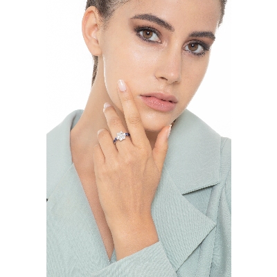 18k white gold ring with diamonds and blue sapphires and burnished tips 