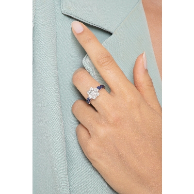 18k white gold ring with diamonds and blue sapphires and burnished tips 