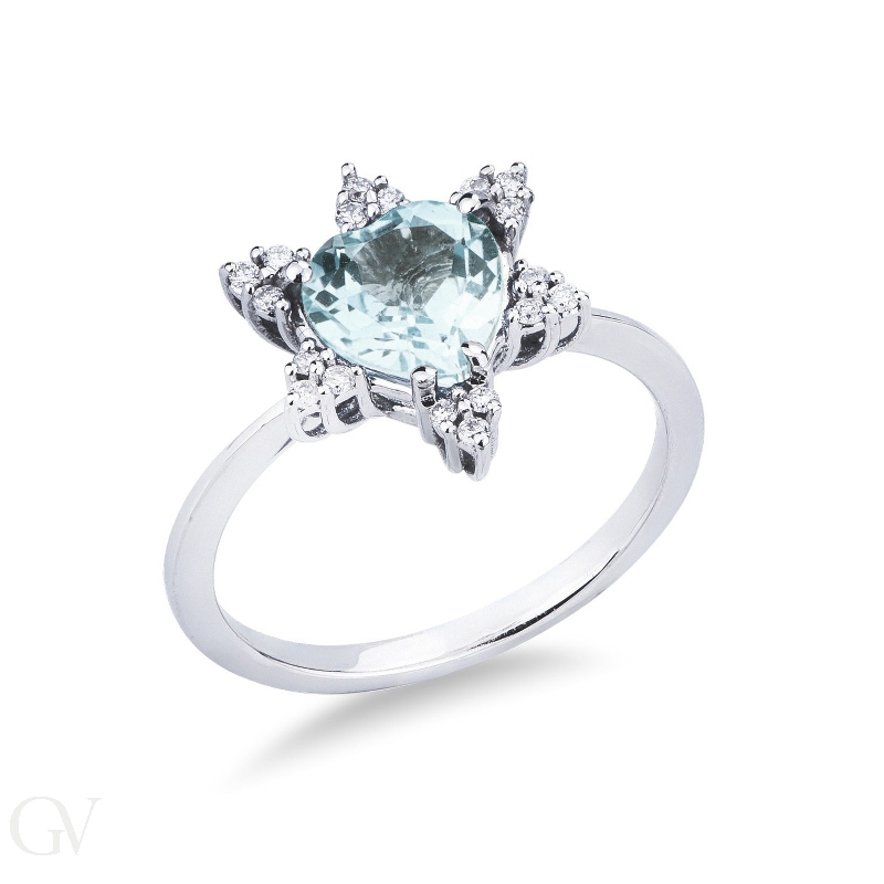 White gold 18k halo ring with aquamarine heart cut and six diamonds' petals