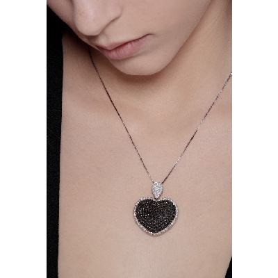 18k white gold necklace with heart pendant with black and white diamonds