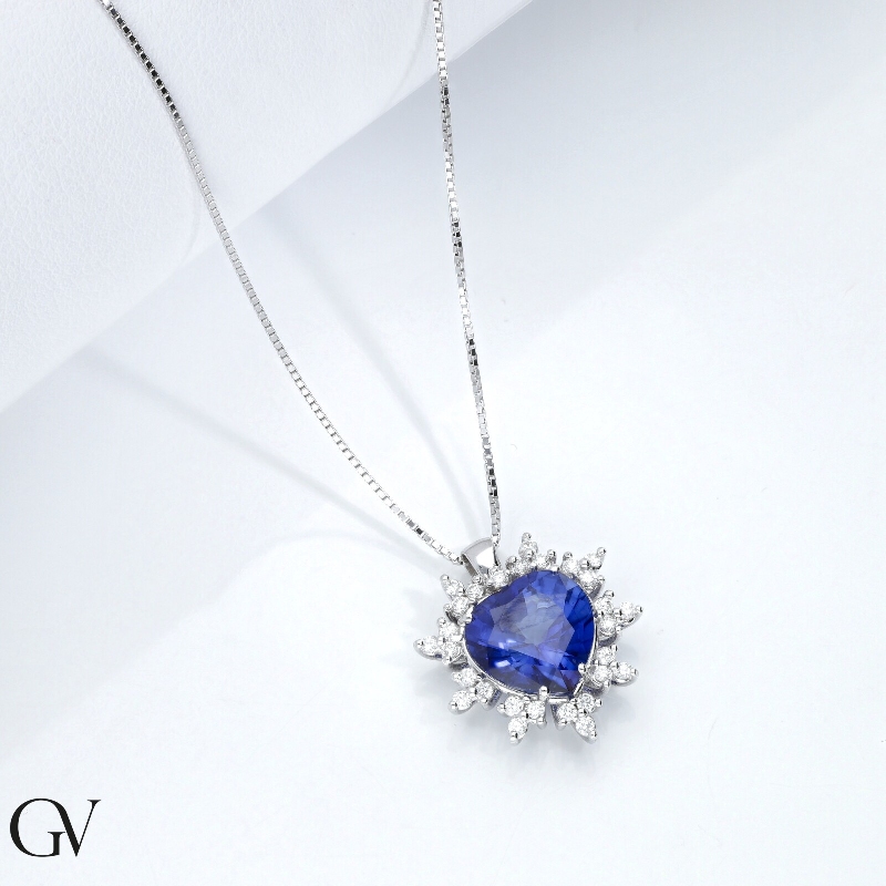 Heart shaped sapphire and 9 petals of diamonds