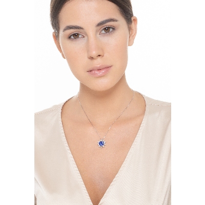 Heart shaped sapphire and 9 petals of diamonds