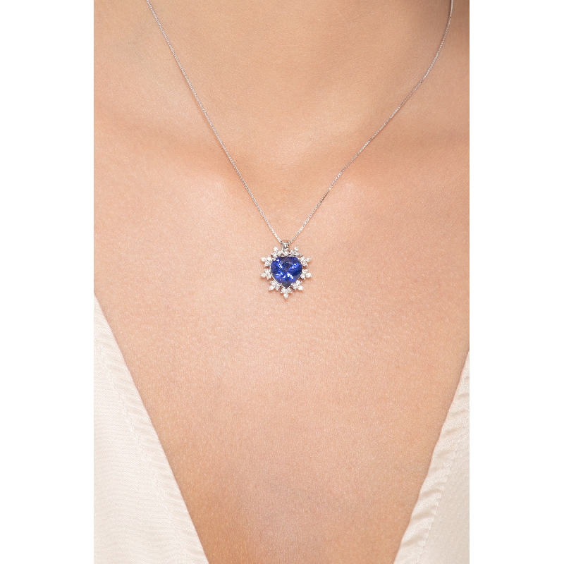 Heart shaped sapphire and 9 petals of diamonds