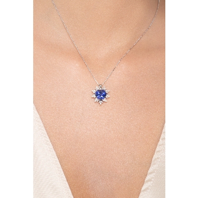 Heart shaped sapphire and 9 petals of diamonds