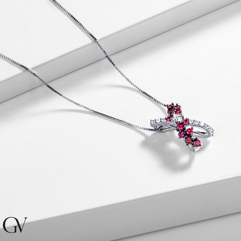 Necklace with fancy twisted pendant with rubies and diamonds