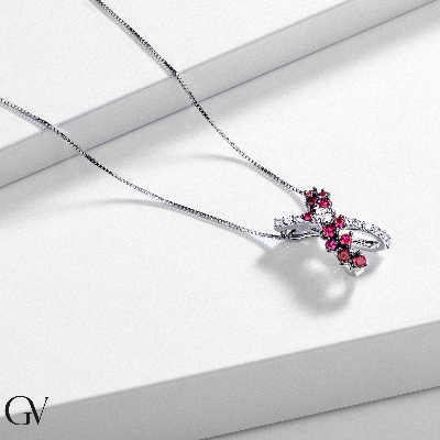 Necklace with fancy twisted pendant with rubies and diamonds