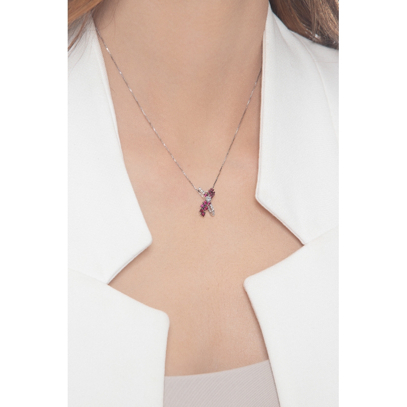 Necklace with fancy twisted pendant with rubies and diamonds