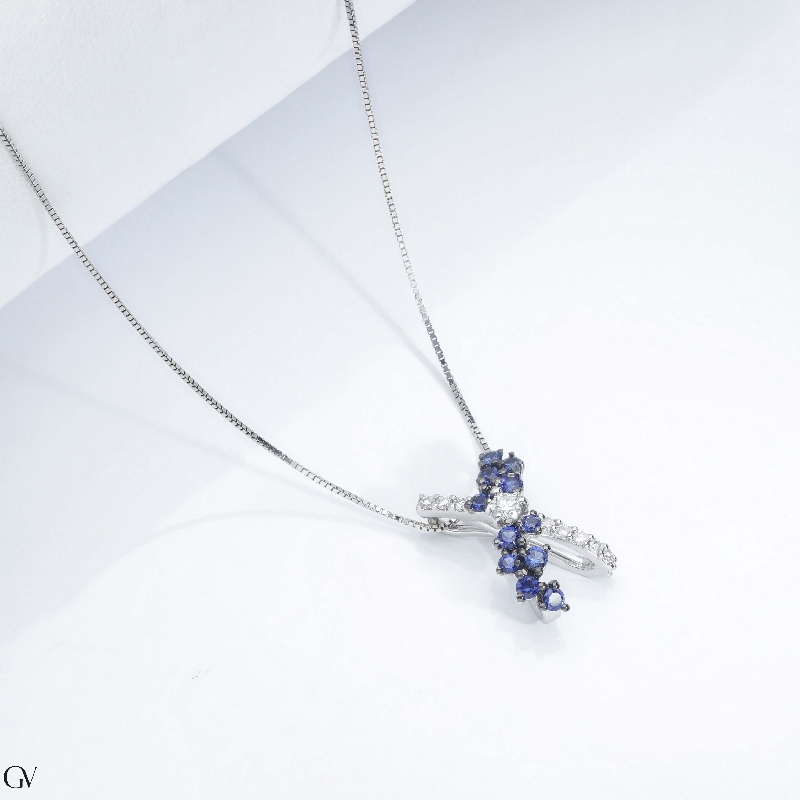 Necklace with fancy twisted pendant with blue sapphires and diamonds