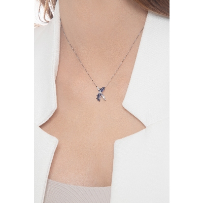 Necklace with fancy twisted pendant with blue sapphires and diamonds