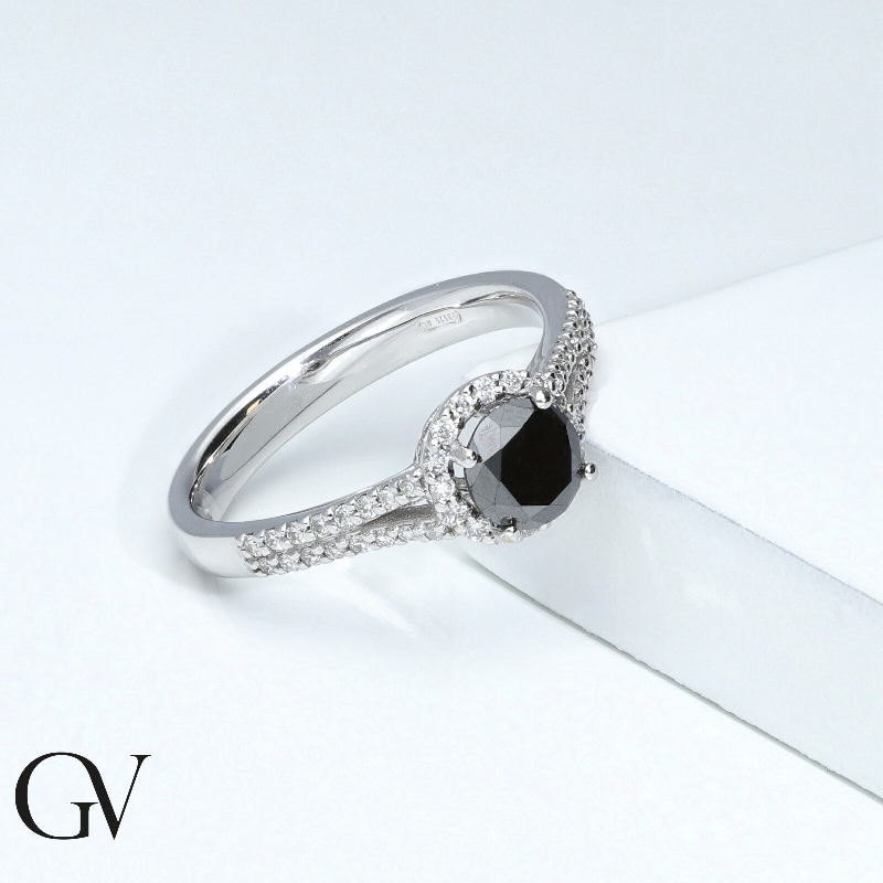 Solitaire type ring with black central diamond and halo and shoulder set diamonds 