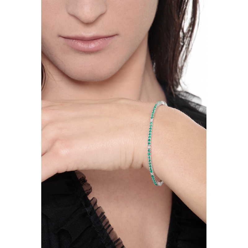 Wire style tennis bracelet with emeralds and diamonds