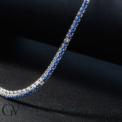 Wire style tennis bracelet with blue sapphires and diamonds