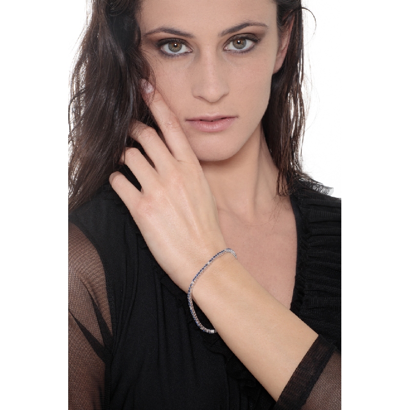 Wire style tennis bracelet with blue sapphires and diamonds