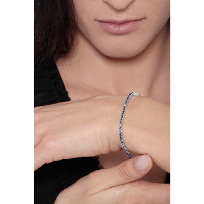 Wire style tennis bracelet with blue sapphires and diamonds