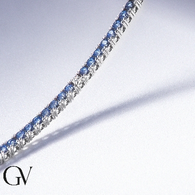 Wire style tennis bracelet with alternated sapphires and round cut diamonds