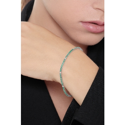 Wire links tennis bracelet with emeralds and diamonds