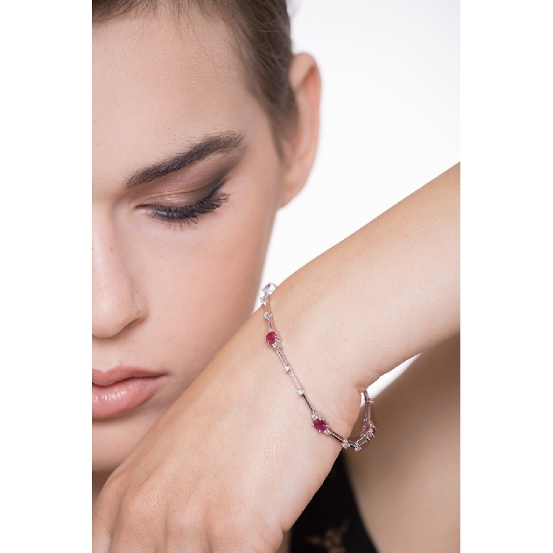 Alternate bracelet with rubies and round cut diamonds