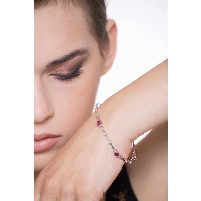 Alternate bracelet with rubies and round cut diamonds