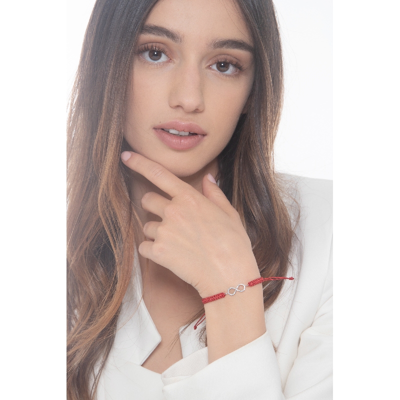 Red fabric cord bracelet with infinite charm in white gold 18k and diamonds