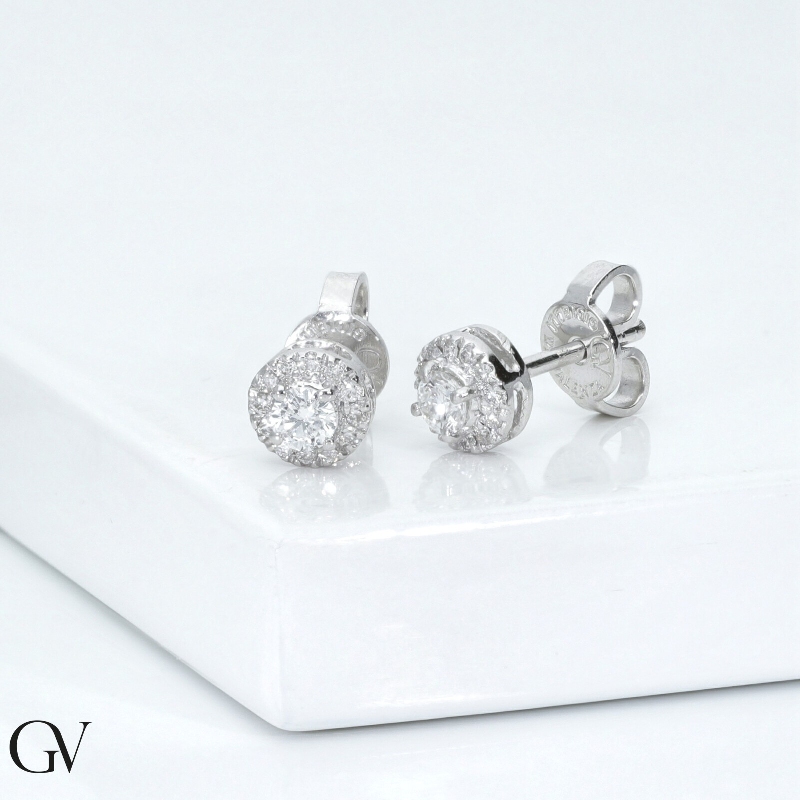 18k white gold earrings with halo in diamonds and central diamond of about 0.10 ct