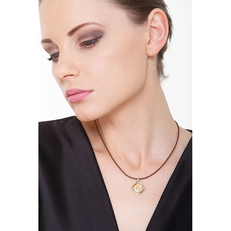 Medaglia sacra con Madonna e bimbo in oro giallo 18k.